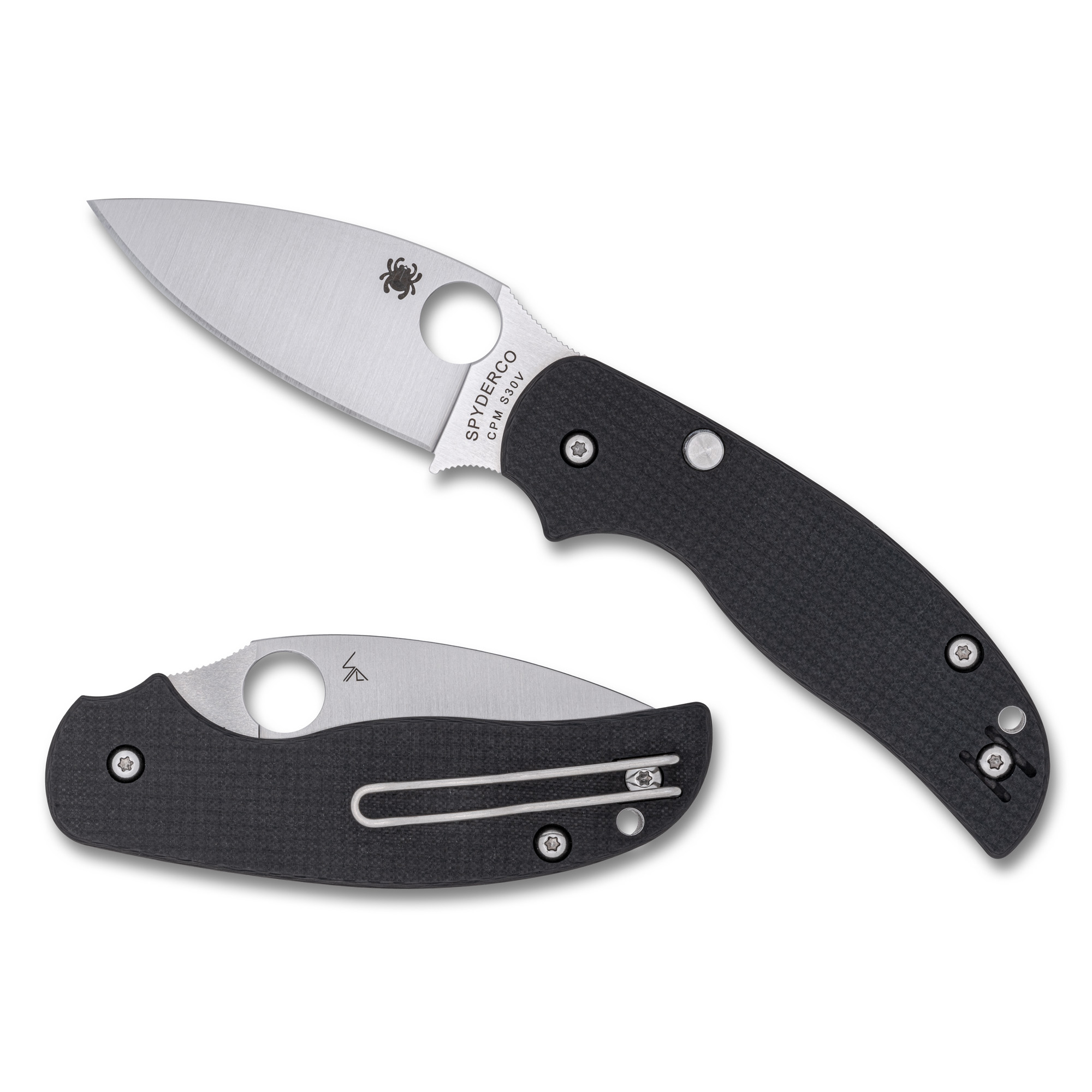 Spyderco Sage 6 folding knife with a satin-finished drop point blade and black carbon fiber/G-10 laminate handle, shown open on a rustic surface.